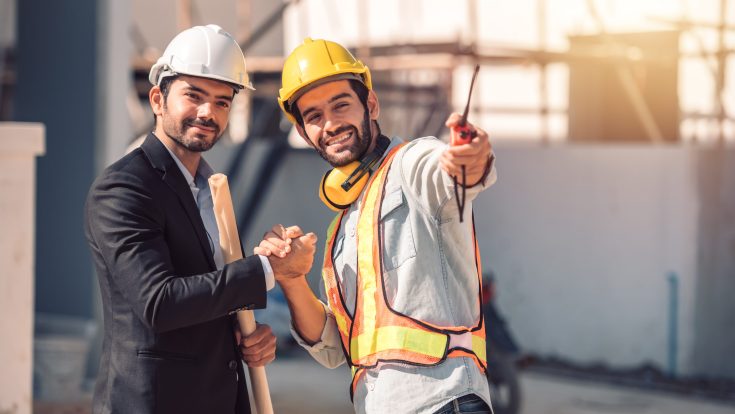 happy-workers-construction-site-young-civil-engineer-manager-architects-handshaking-construction-site-looking-construction-phase-cooperation-teamwork-concept Happy workers at construction site, young civil engineer manager and architects handshaking at construction site and looking to next construction phase , cooperation teamwork concept.